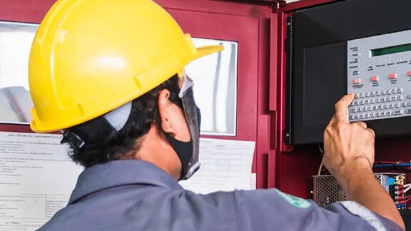 A Technician Operating the electronic devices.